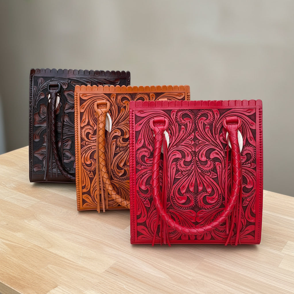 Three leather bags in black, brown, and red with intricate patterns