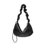 Black handbag with a braided handle 