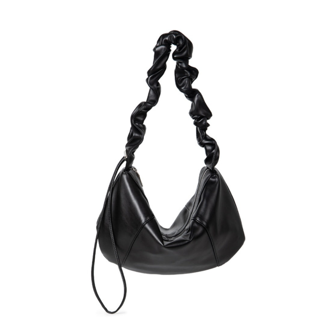 Black handbag with a braided handle 
