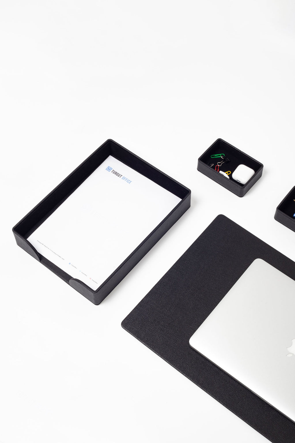 Black rectangular frame with a white sheet of paper