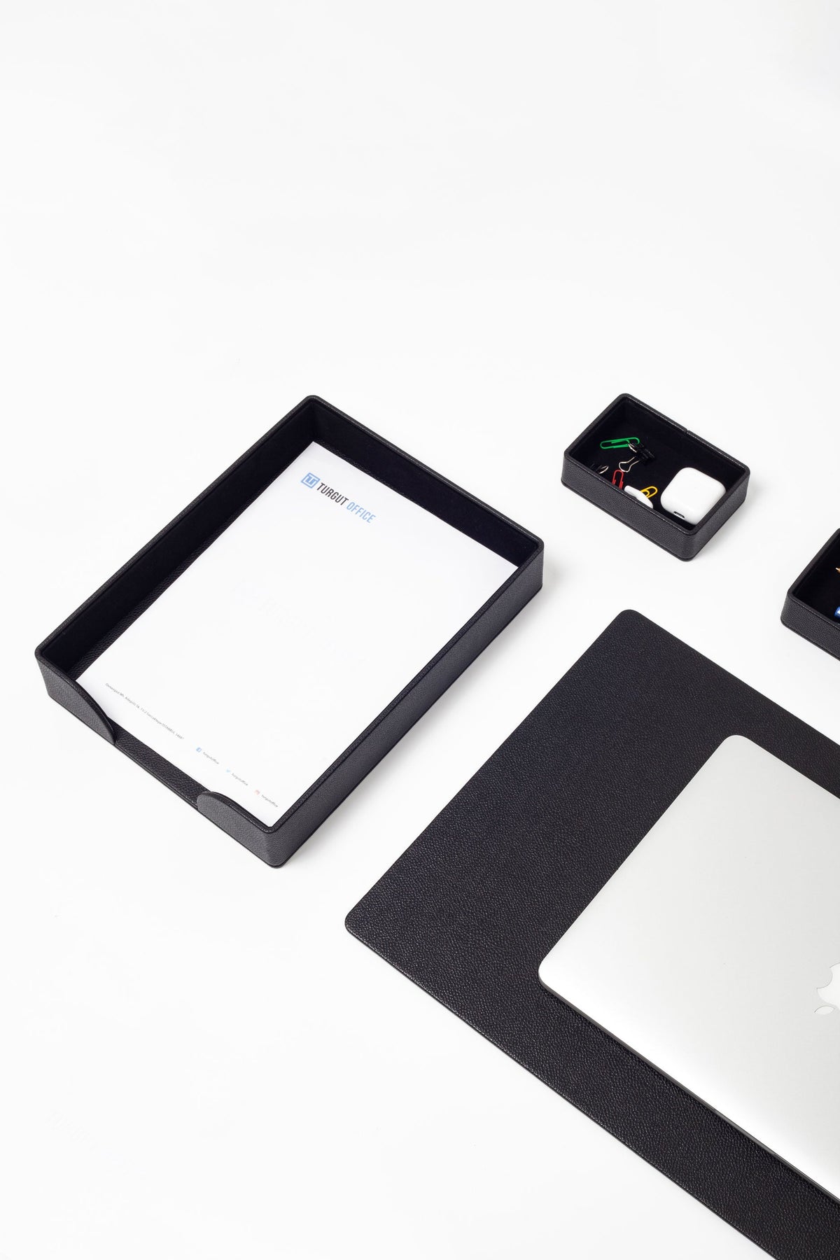 Black rectangular frame with a white sheet of paper