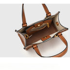 Brown leather handbag with gold accents