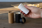 Compostable  cosmetic containers in black, brown, and white-
