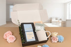 Gift set with tea, chocolate, and a mug on a beige background