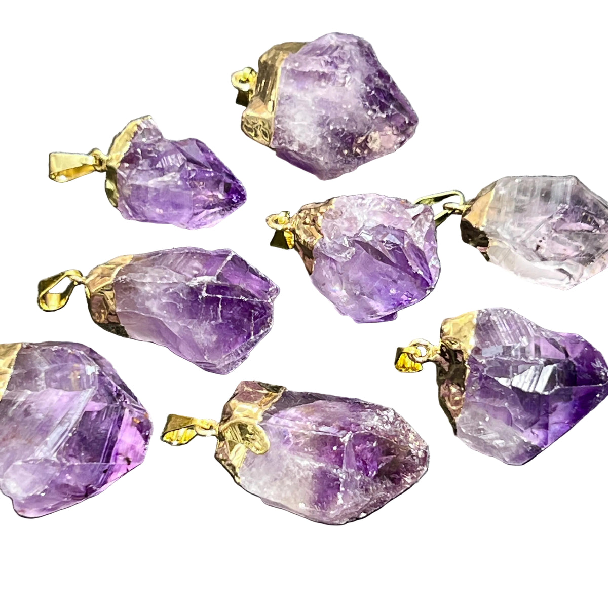 Amethyst crystal pendants with gold accents