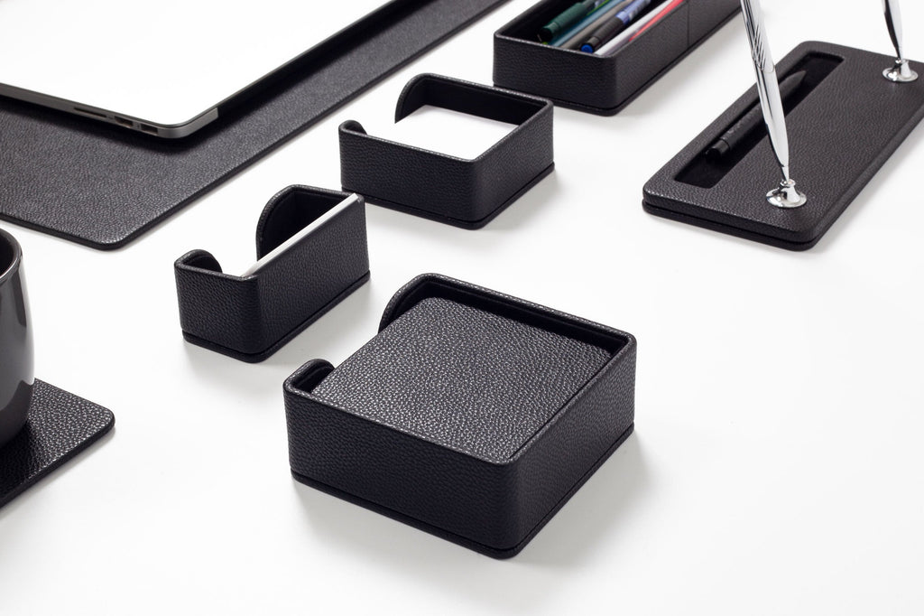 Set of black desk organizers on