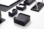 Set of black desk organizers on