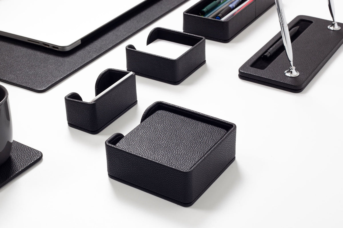 Set of black desk organizers on