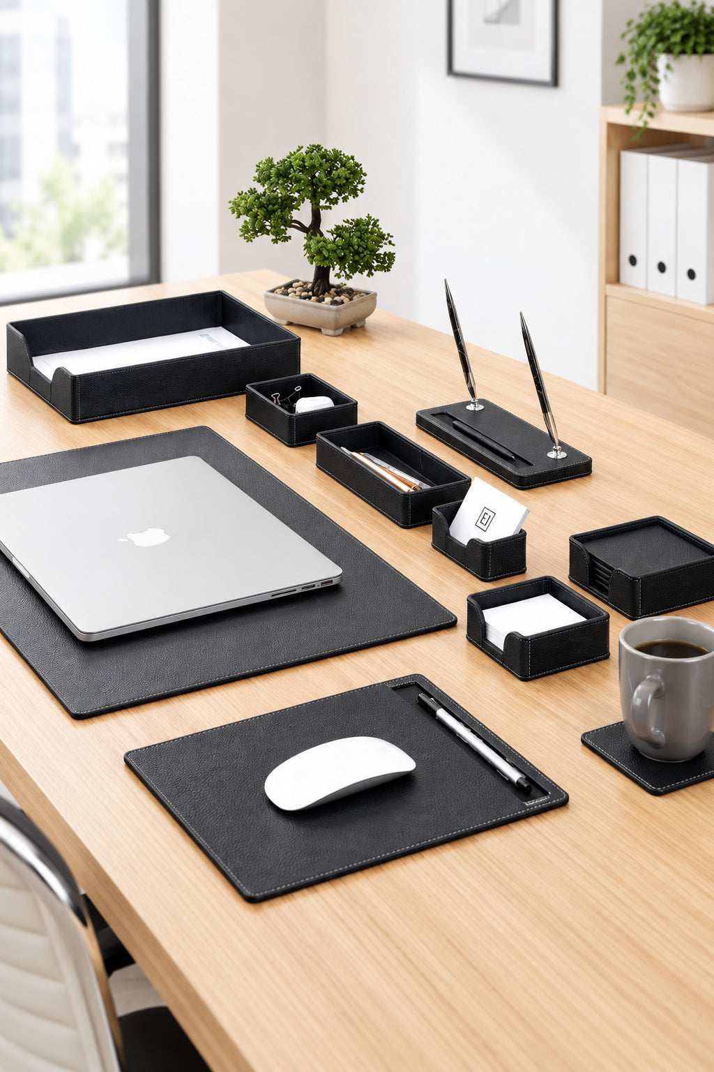 Wooden desk with office supplies including a laptop, mouse, and stationery items.
