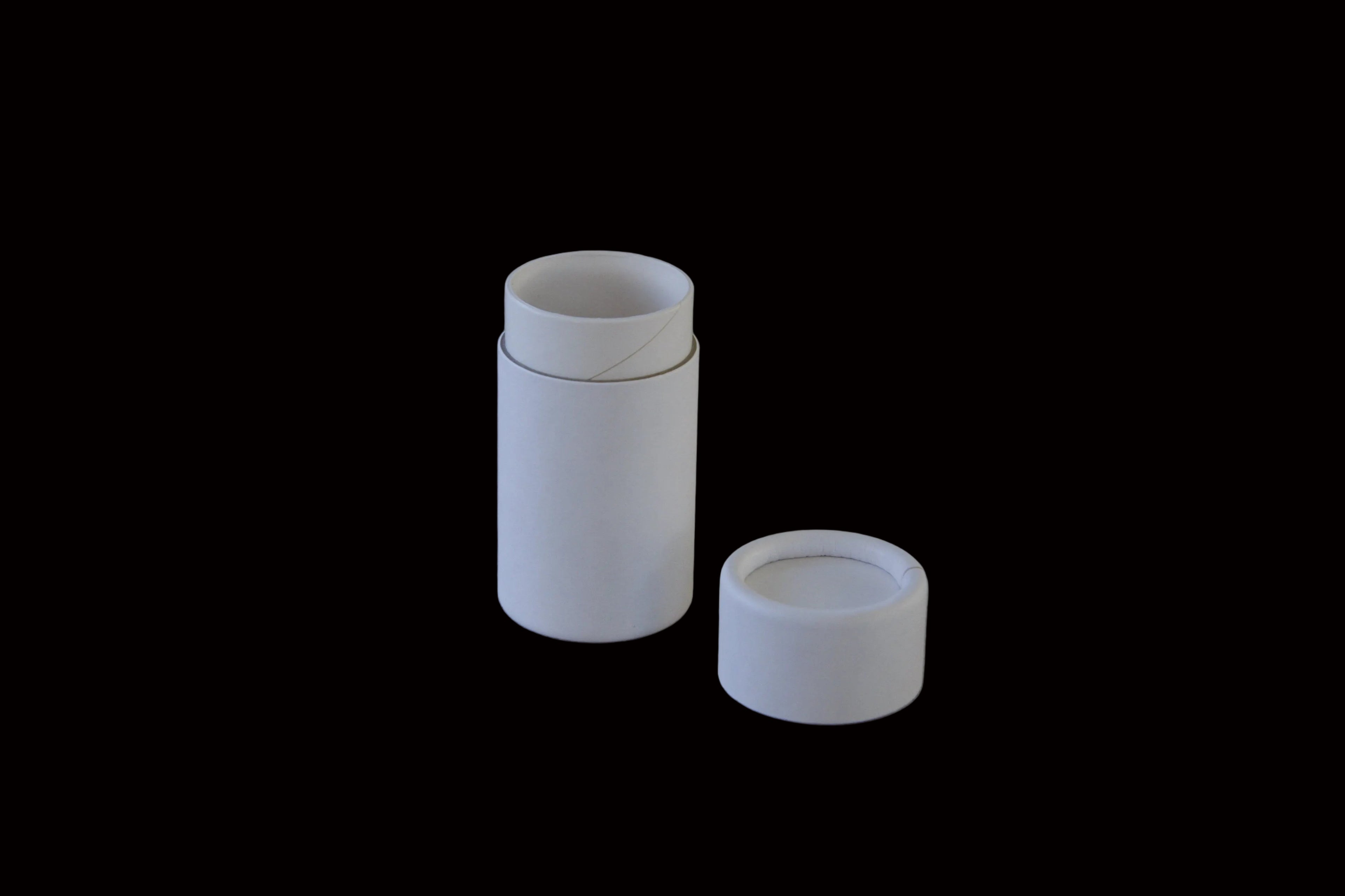 eco friendly Two white cylindrical containers