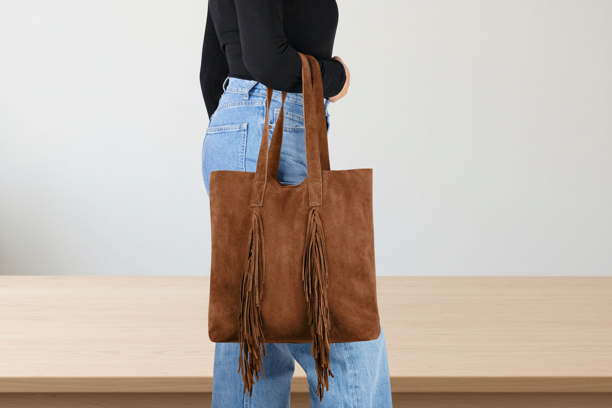 leather bucket bag with drawstring closure and leather strap