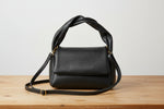 brown genuine leather hobo bag styled with casual outfit