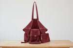 brown genuine leather shoulder bag worn crossbody on model