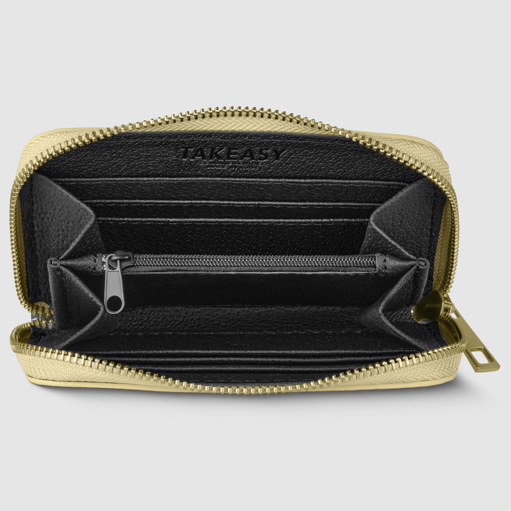 Gold zipper pouch with black interior on a light gray background