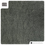 Textured gray car mat with a small metal clip on a matching gray background