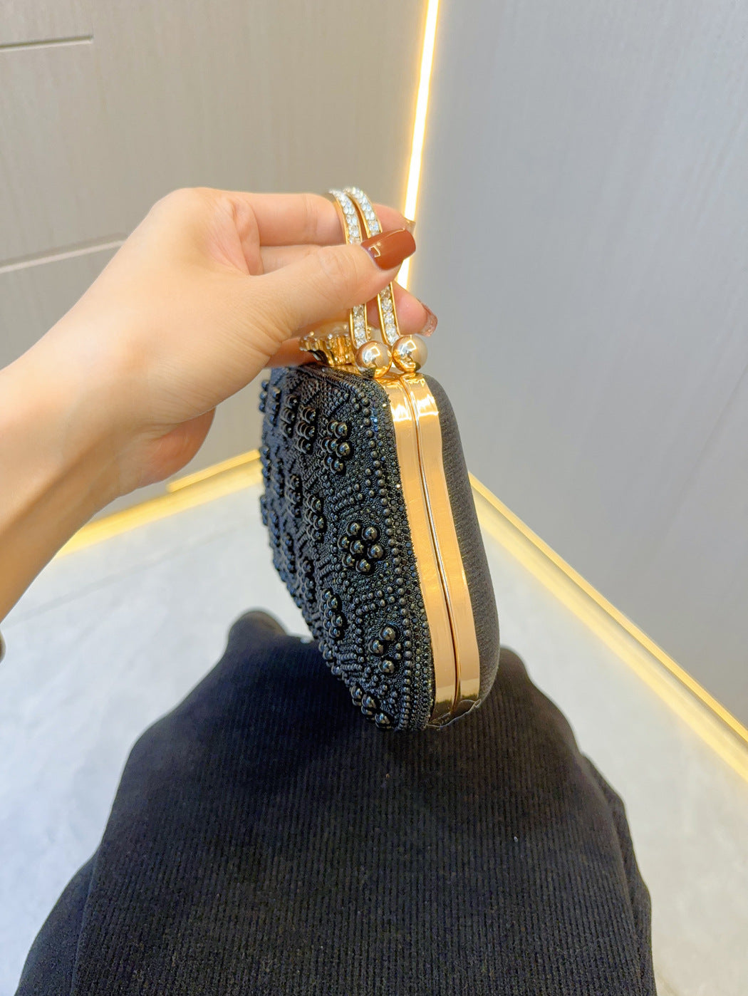 rhinestone embellished clutch bag with top handle