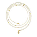 Three pearl necklaces with gold clasps on a white background