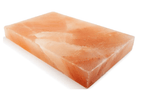 Rectangular pink salt block on a white background