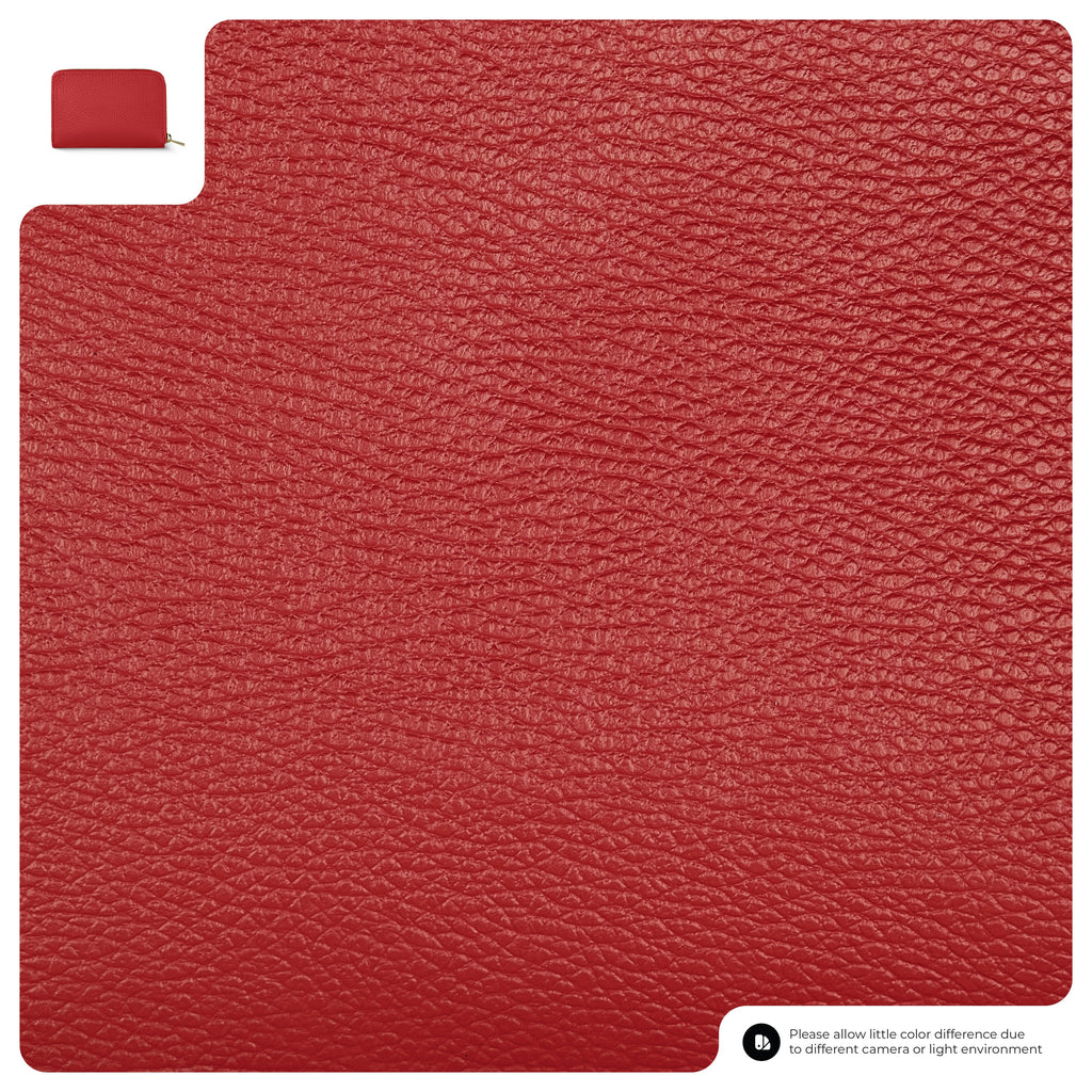 Red textured rug with a small red bag on top