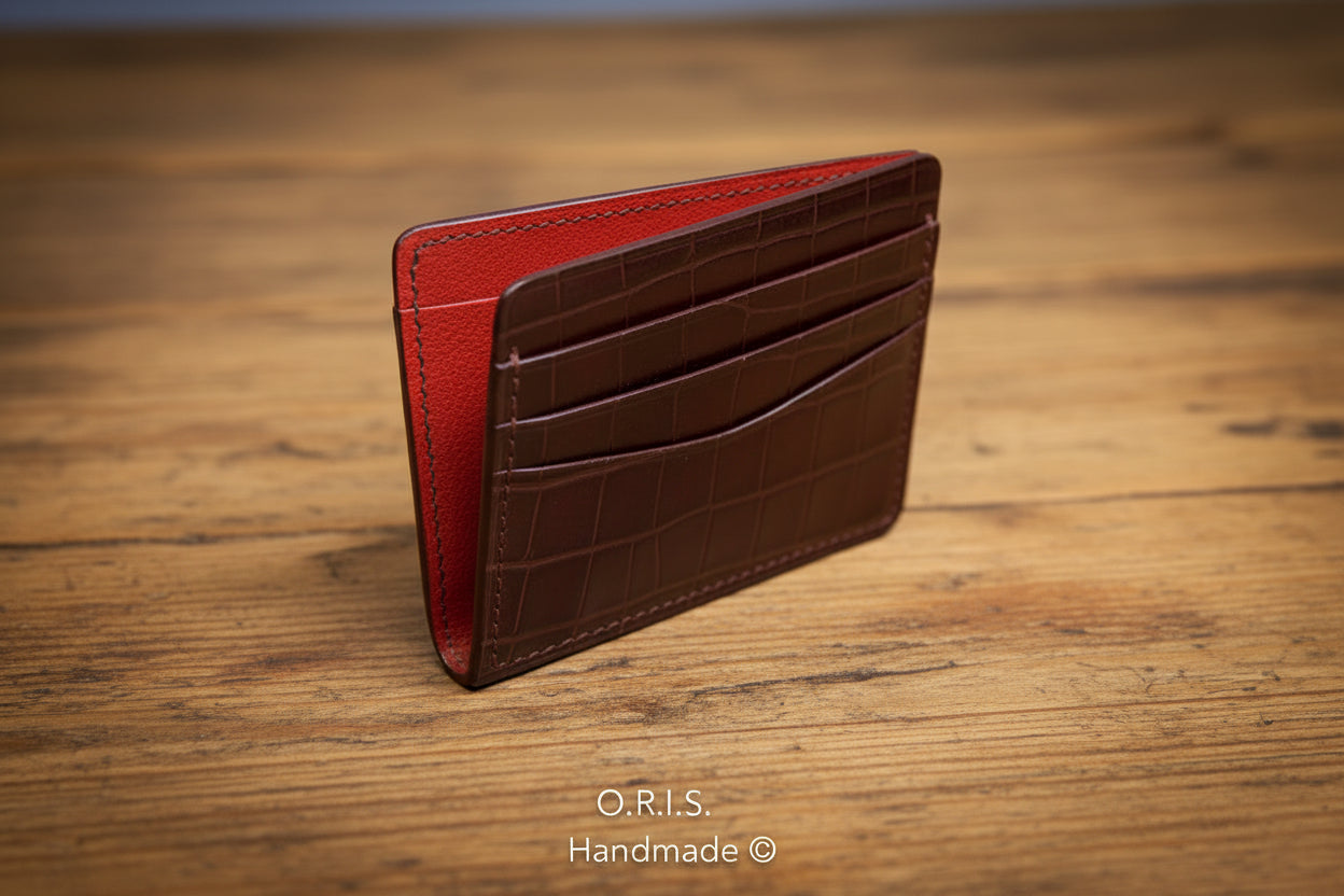 Red and brown leather wallet on a light gray background