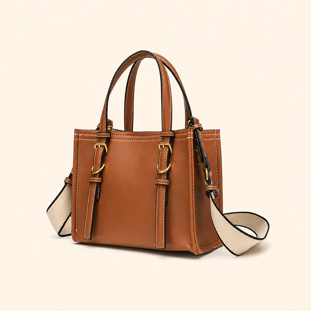 A structured tan leather handbag with double top handles