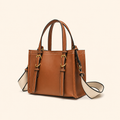 A structured tan leather handbag with double top handles