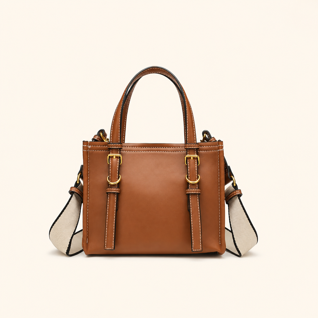 A structured brown leather handbag with dual top handles