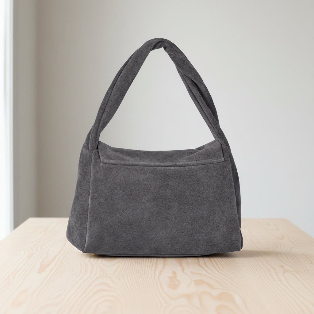 Gray handbag on a light gray background